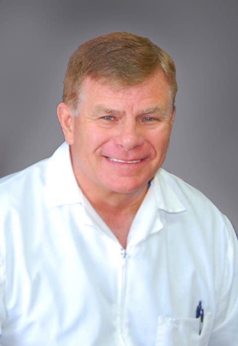Dr. Craig L. Barcomb.